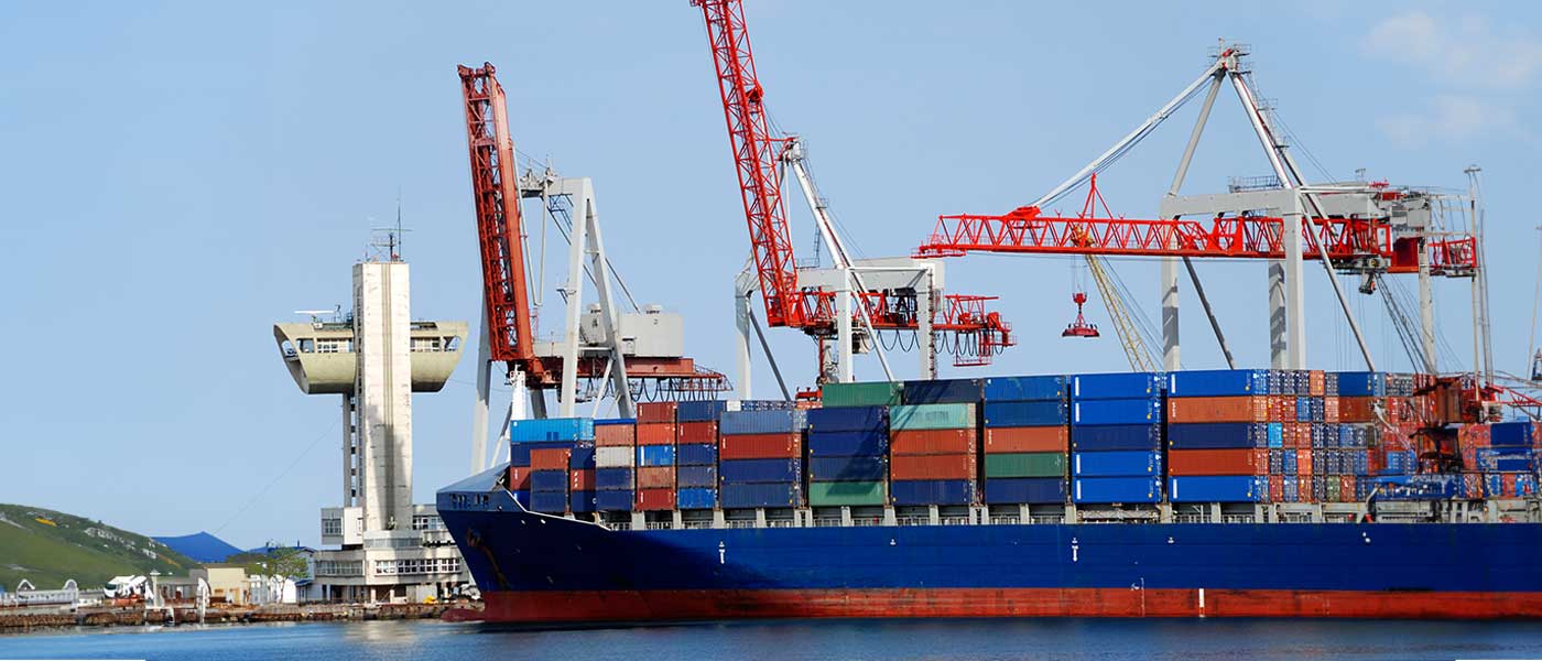  A Ship at a Port with Shipping Containers