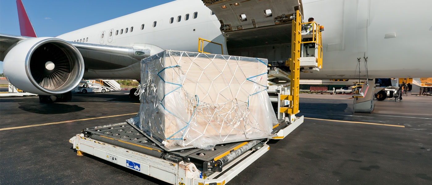 A man loading cargo onto the plane