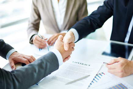 Gentle hand-shaken between two businessmen